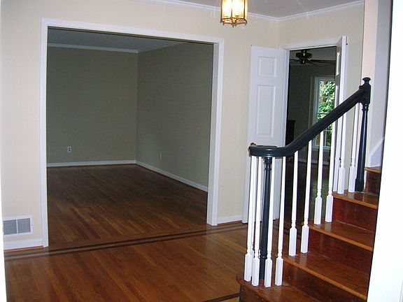 Foyer opens to formal living room and french doors lead to family room
