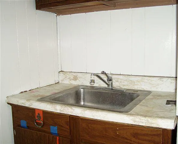 stainless steel kitchen sink - lots of cabinet storage