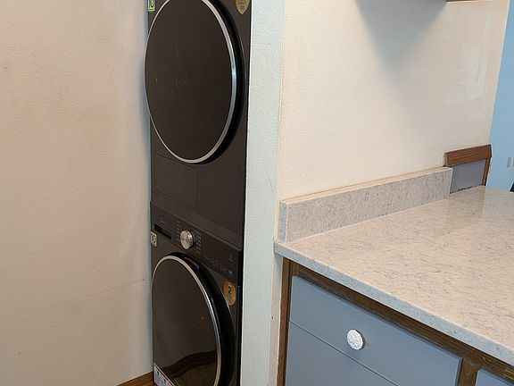 closer view of the new washer and dryer (stacked)