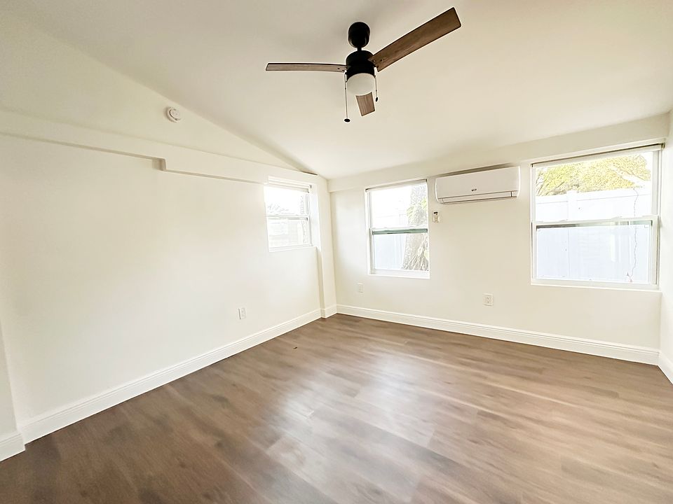 Living room has incredible natural light and lots of privacy, even with the windows open.
