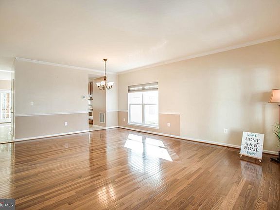 Crown molding and chair rail accent this space