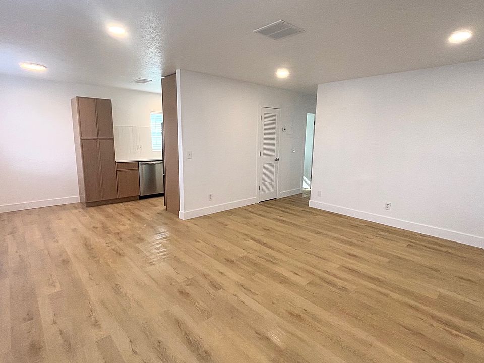 View front front door. Open concept living dining room.