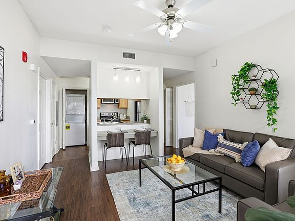 Enjoy Open-Concept Living with a Cozy Lounge Area in Your Furnished Living Room