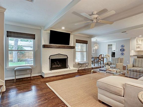 The living room has great natural light and a gas log fireplace.