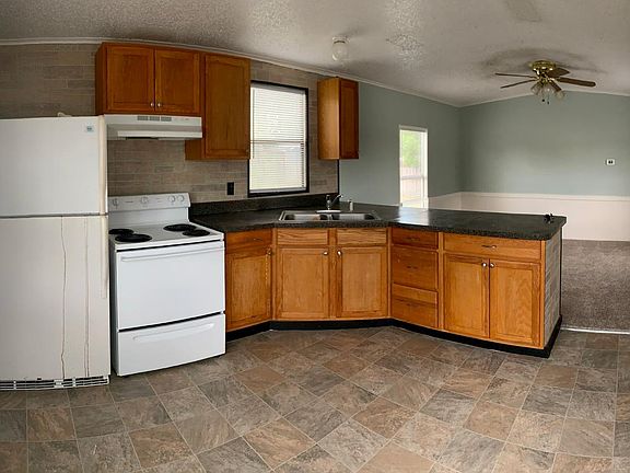 Kitchen looking into living room