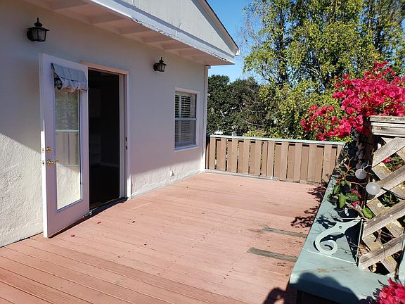 Deck with door open back in to Living Room/Dining Room