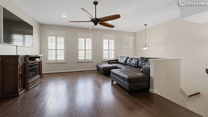 Relax by the fireplace or enjoy a movie on a 75in TV. - 8104 Sport View Rd #1
