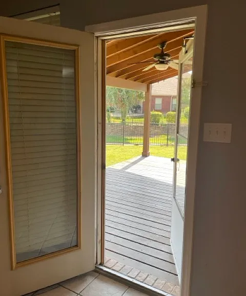 Back door off of kitchen nook leading to deck & back yard.