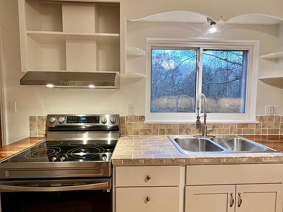 kitchen range sink window to back yard
