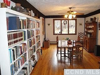 12 x 19 DR has floor to ceiling bookshelves.