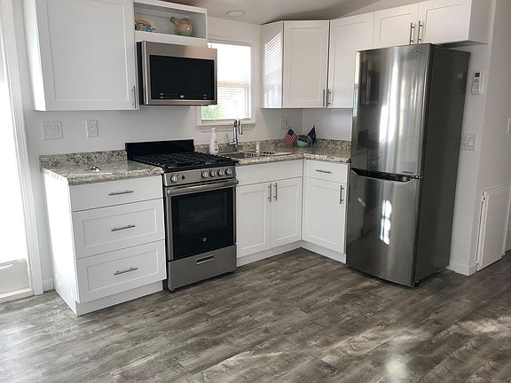 Everything is new including premium appliances. Gas stove, microwave and freezer/fridge