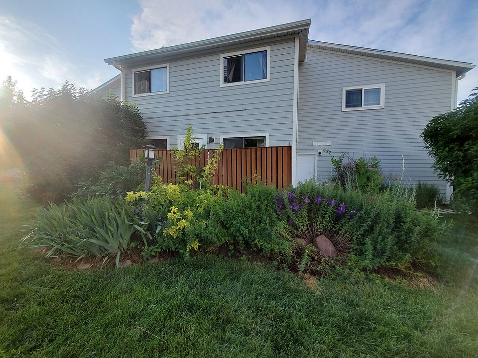 Looking at our home gardens, door into our garage, 2 BR 2nd floor mtn view