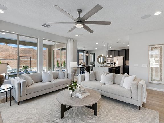 Open first floor gathering room, kitchen, and cafe.