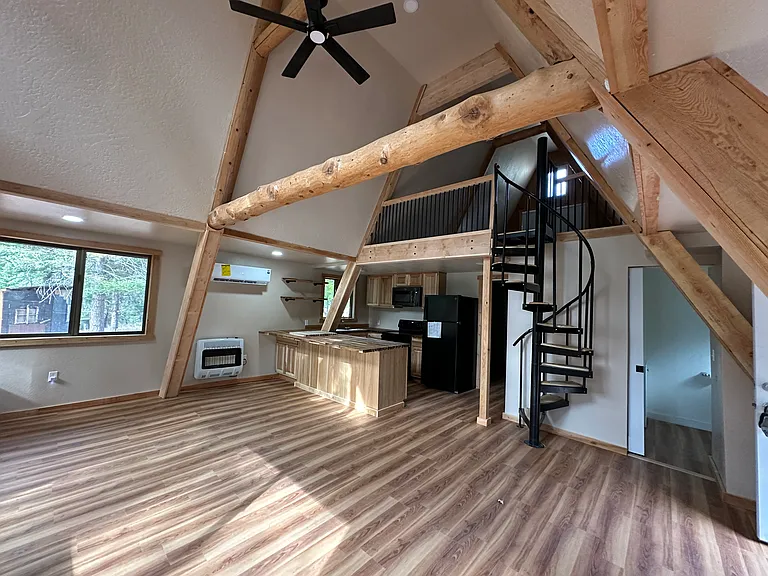 Kitchen, living room, stairs to loft. 
Washer and dryer to the right of kitchen.