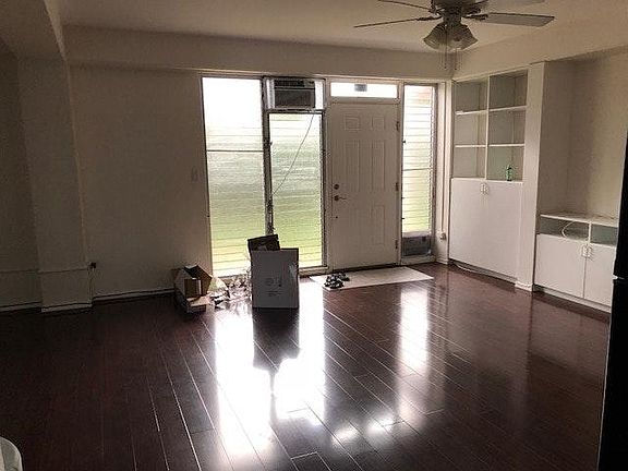 front door/living room with AC