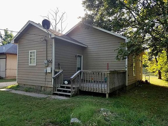 Back of home with deck
