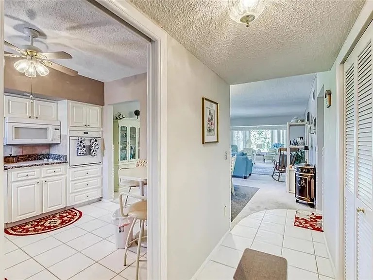 Entry hallway. The kitchen is immediately to the left; living room and Florida room is straight ahead.