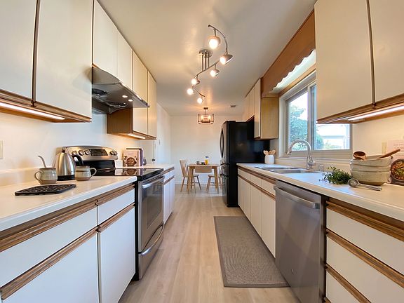 Newly renovated kitchen floor that comes with dishwasher and refrigerator