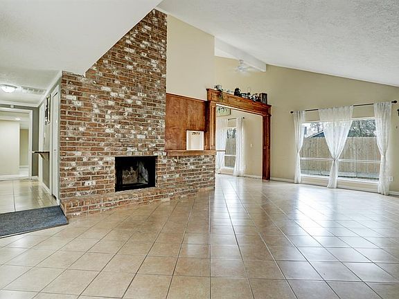 Large brick fire place makes for a cozy room