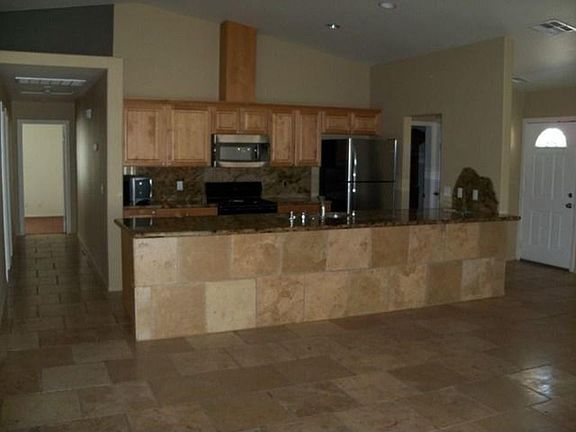 Designed for entertaining, this kitchen features a large breakfast bar
