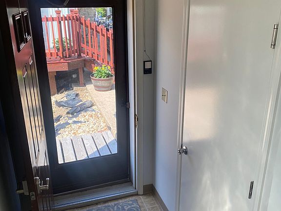 Interior entrance to garage apartment. Access door to garage on right.