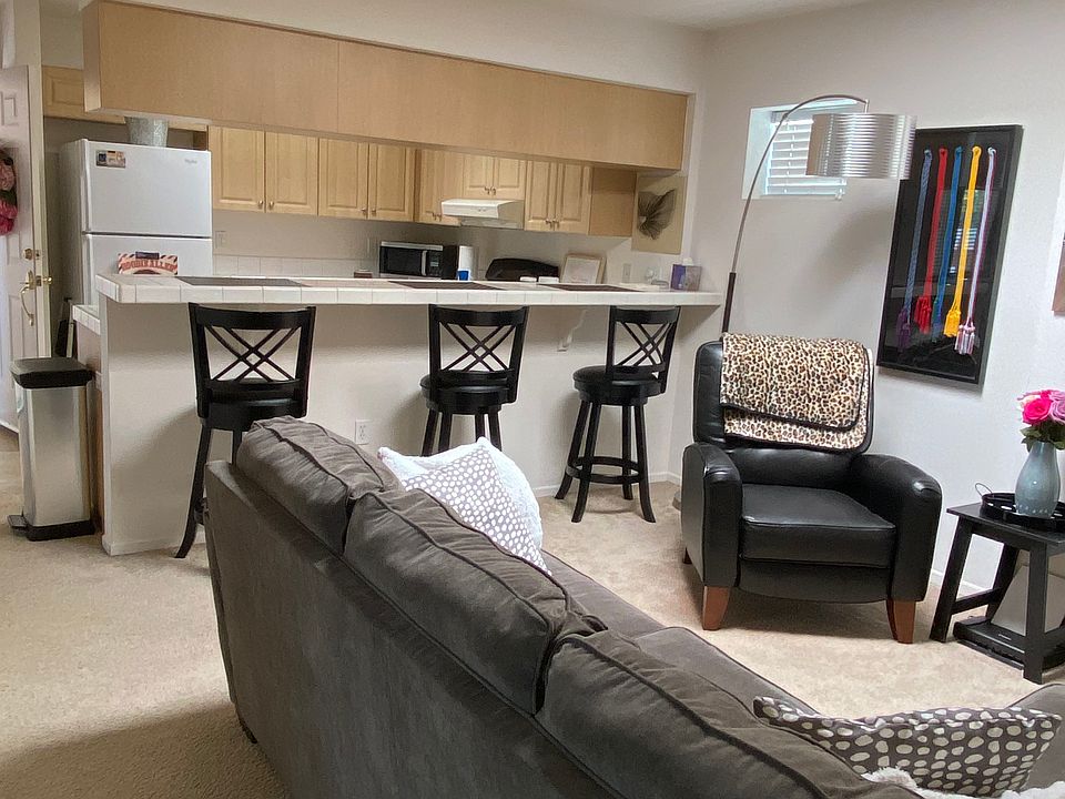 Living room, bar counter and kitchen.