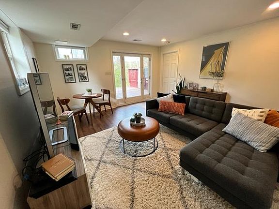 Open concenpt living area and dining area. Entrance pictured. This is a walkout basement.