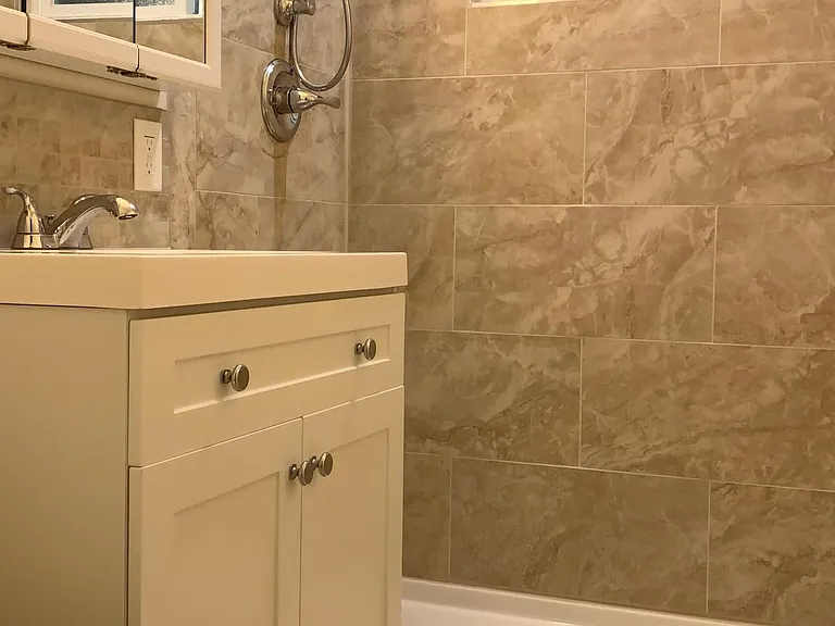 Bathroom sink and shower, upstairs