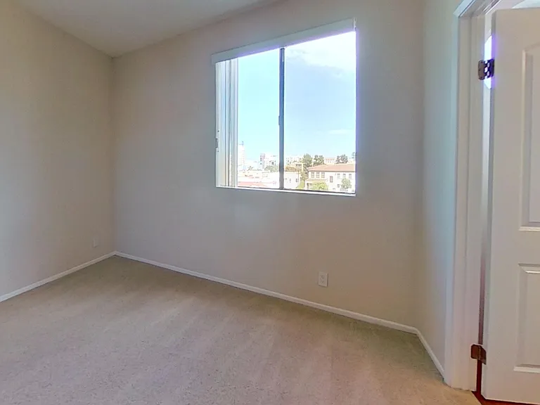Primary bedroom of apartment #319