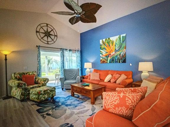 Living room with sliding doors to Florida room