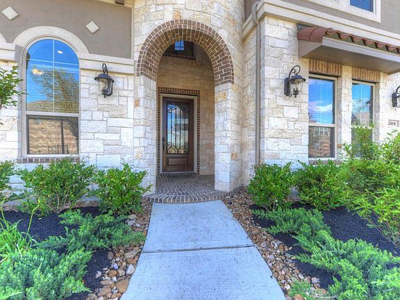 Beautiful front entrance to your home with landscaping!