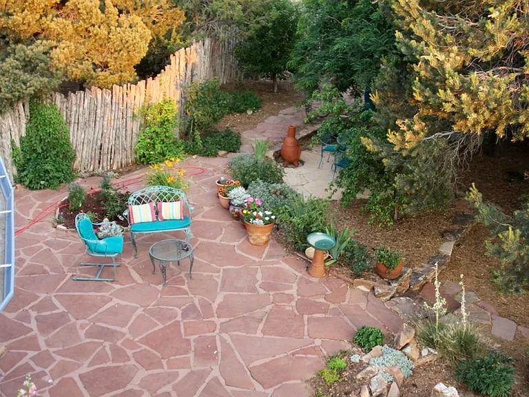 Second fenced patio with additional dining and seating area