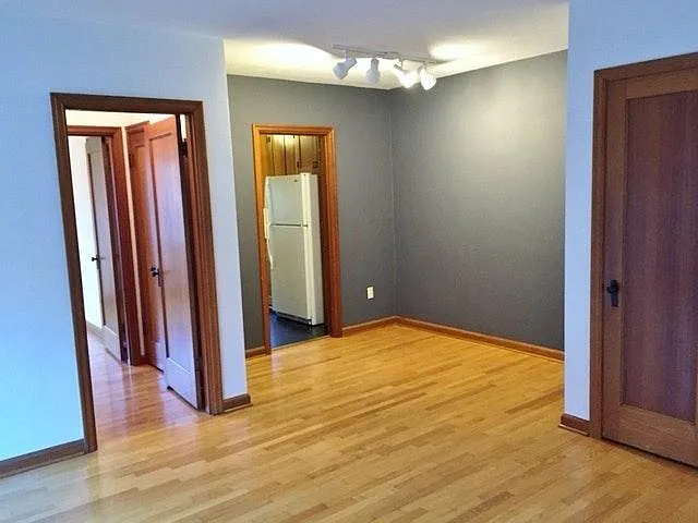 Dinning area with accent walls, lighting & hall closet.