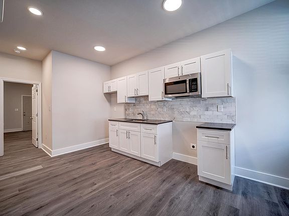 Kitchen includes a stove and fridge