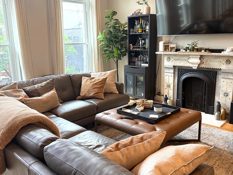 Living room with original marble fireplace.