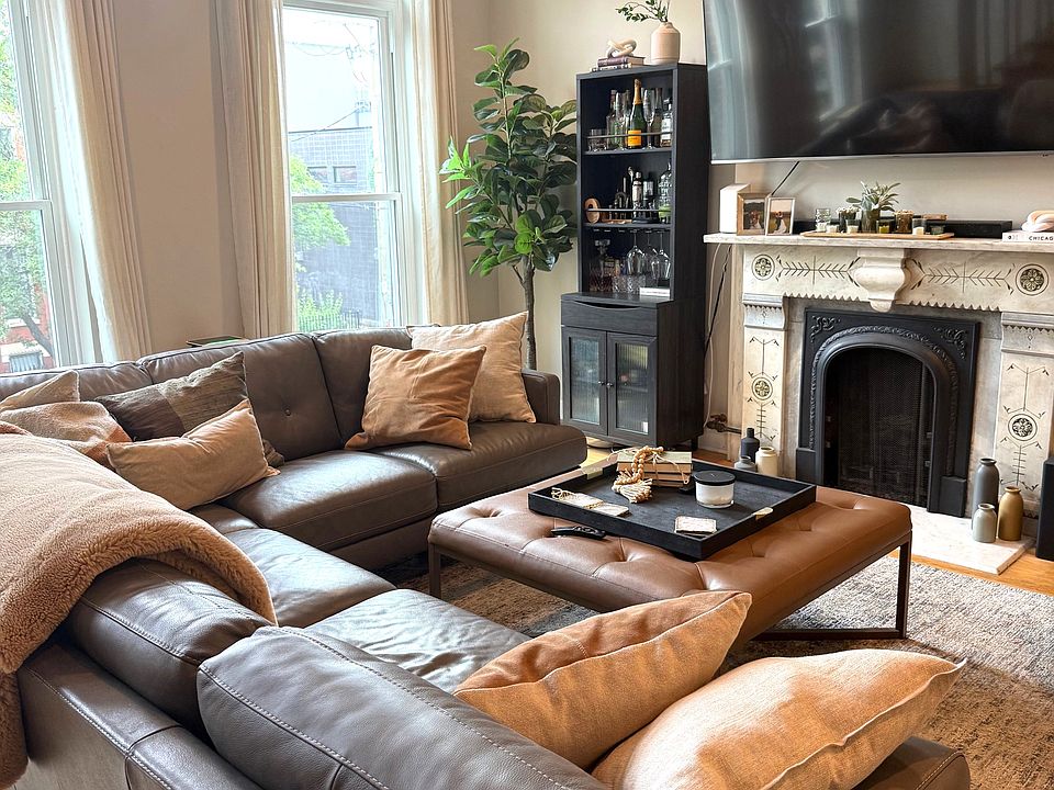 Living room with original marble fireplace.