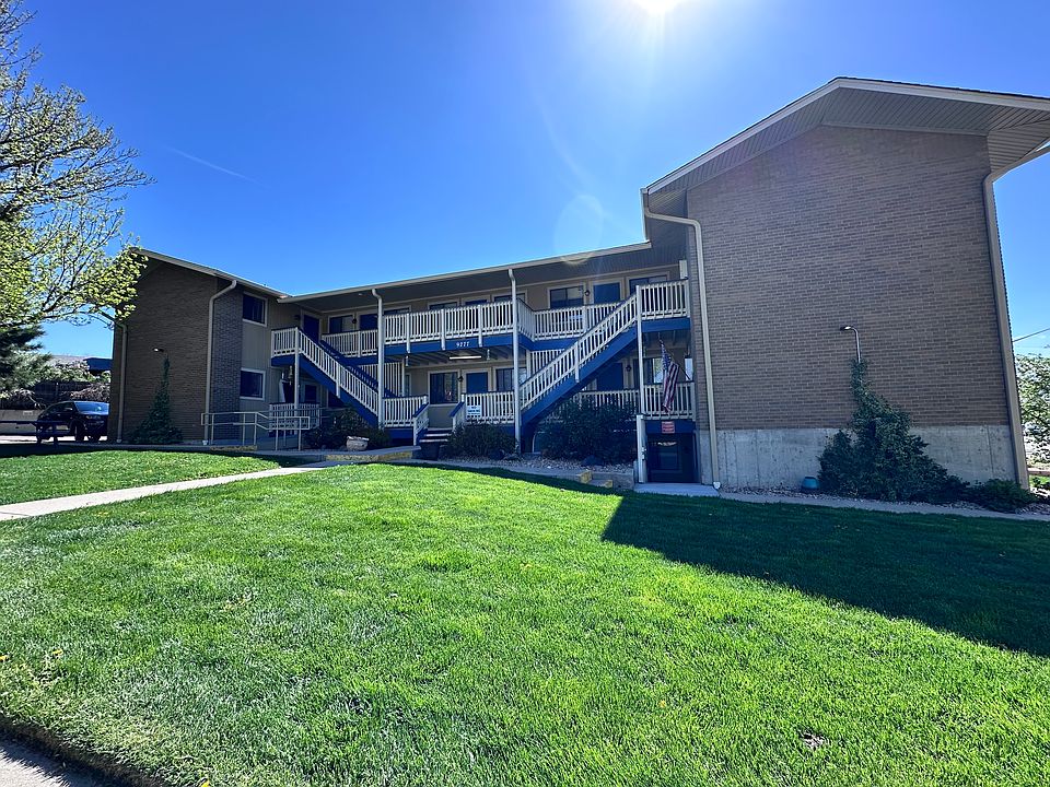 Front of building, set in park-like setting