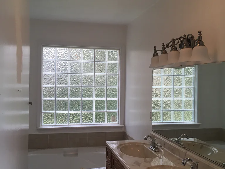Master bathroom with double sinks, soaker tub and shower.