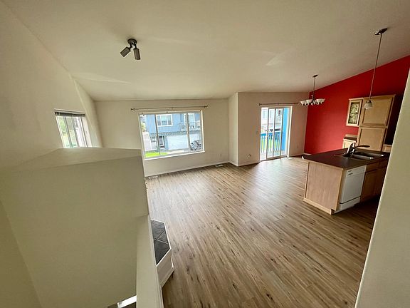 Upstairs great room with living area and kitchen. New luxury vinyl floors.