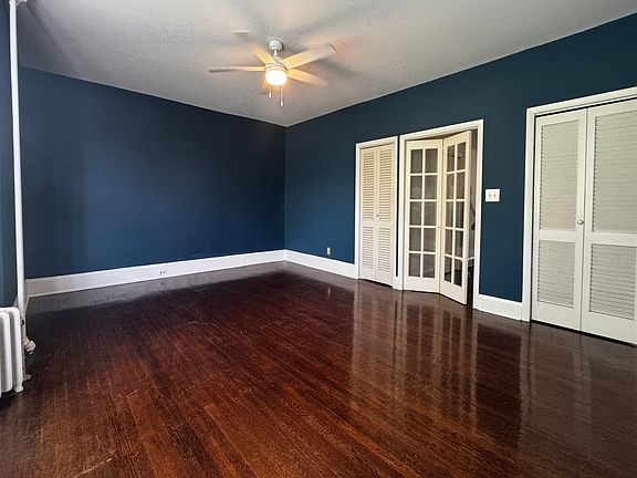 Large bedroom, French doors lead to hall