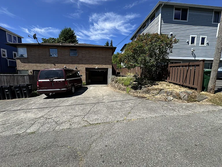 Parking in alley with garage