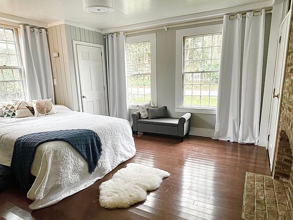 Downstairs bedroom with fireplace and his/hers closets