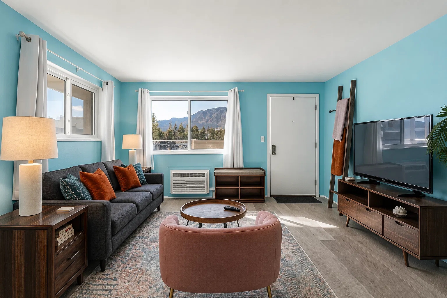 Soak in mountain views from this bright and welcoming living room _ a cozy retreat that feels both playful and peaceful the moment you arrive.
