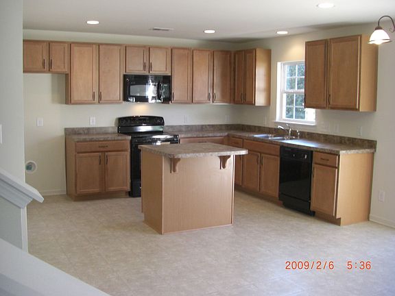 View of kitchen from near staircase