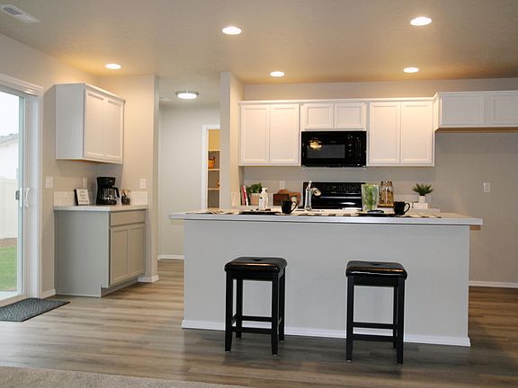 Kitchen with coffee nook, refrigerator installed and included.