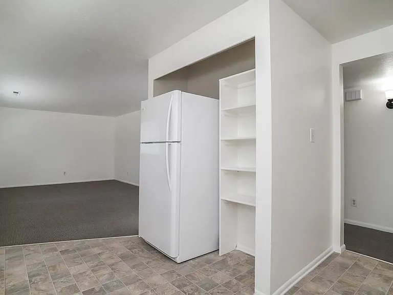 Additional Kitchen Pantry and New Frig;
Hall Entry to 2 Bedrooms Separated by Bathroom