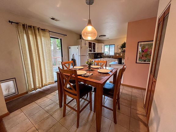 Dining room, sliding door, and built-in dog door