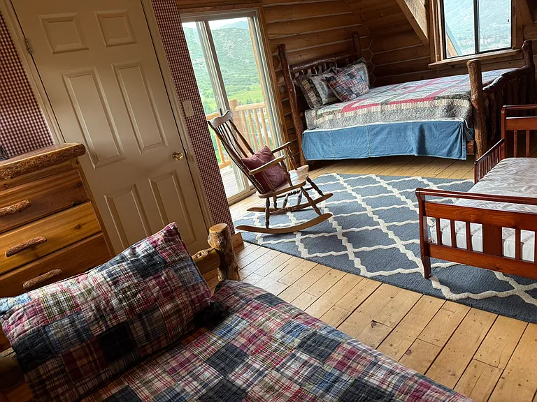 Top floor, west sleeping area: queen bed, twin daybed, toddler bed