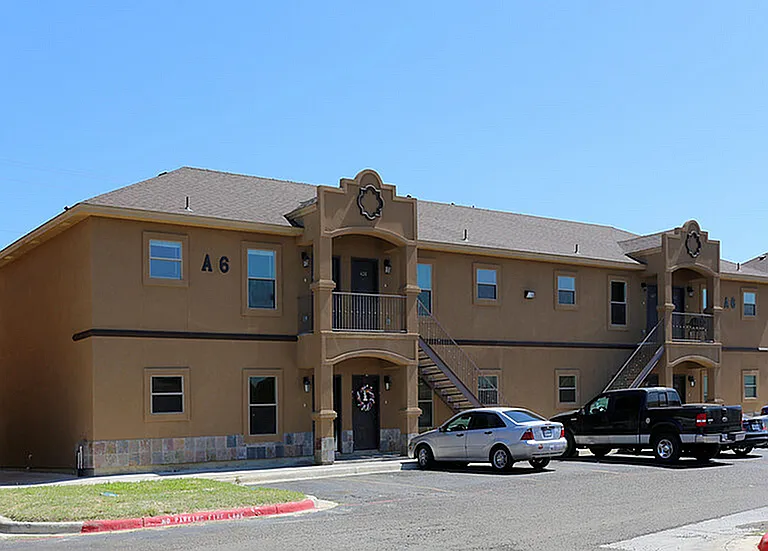 Merida Vista Apartments in Laredo, TX - Exterior Building Apartment A6 with Parked Cars