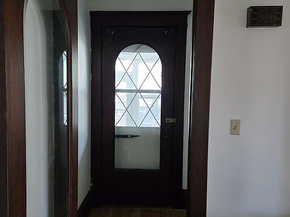 Beautiful entry way with gorgeous hardwood woodwork.